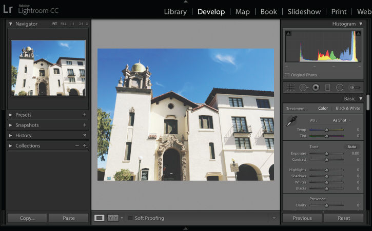 Large, ornate home photographed from a low angle outdoors causes the building to appear skewed. 