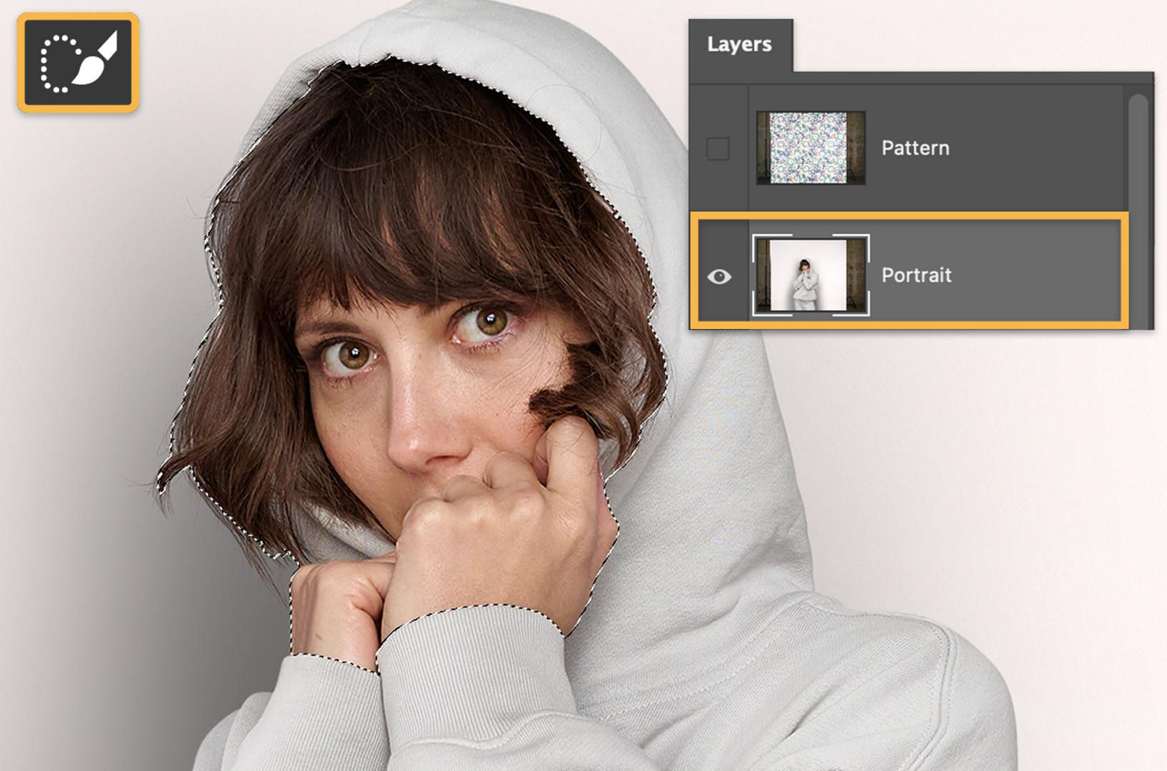 A girl wears a white hoodie. The Portrait layer is selected and a selection is made around her face and hands with the Quick Select tool.