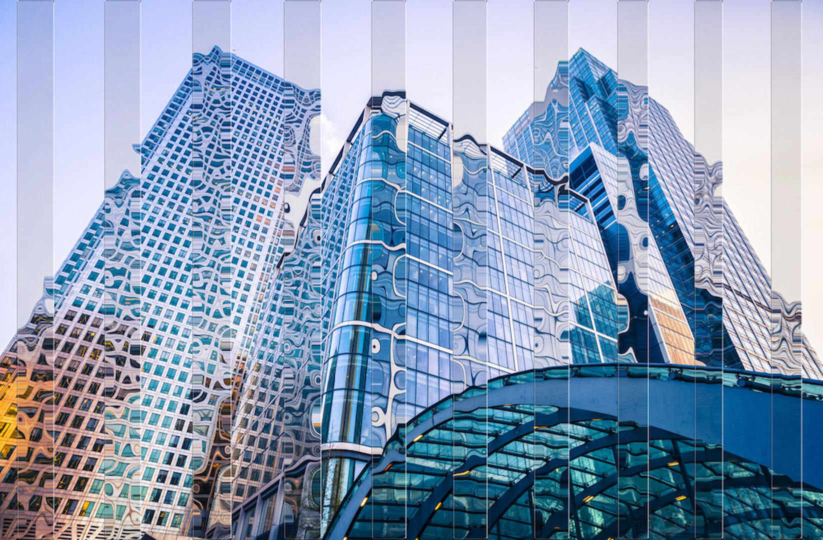 A low angle view of a skyscraperDescription automatically generated