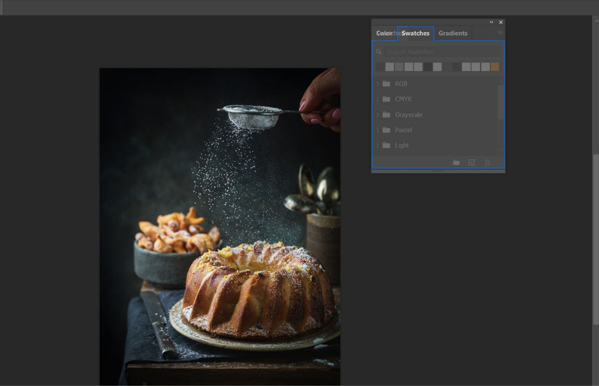 Adobe Photoshop workspace displays grouped panels, with one panel tab being dragged into a highlighted drop zone within a group.