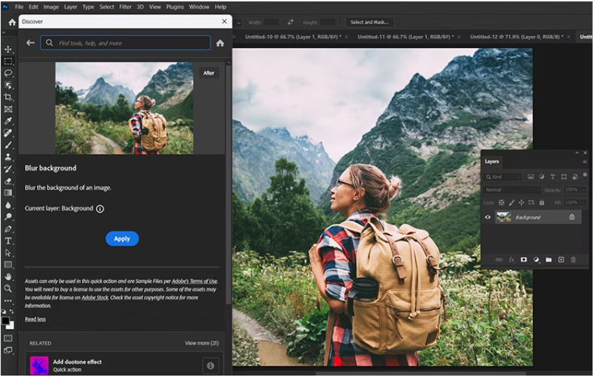 Photoshop workspace showing the Discover panel with the Blur background quick action selected and a landscape photo open on the canvas. 