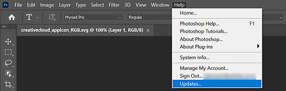 The Help menu in Photoshop is open with Updates highlighted.