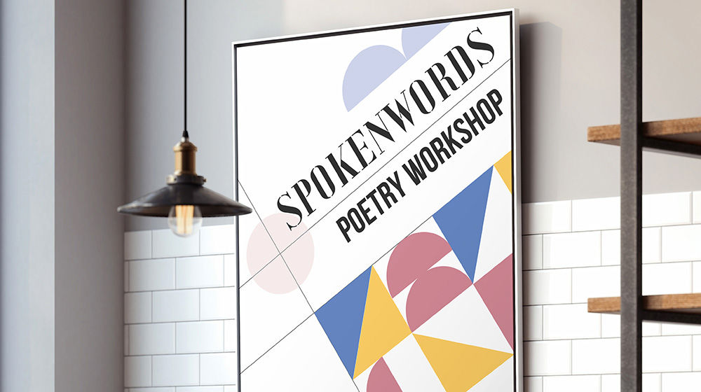 Spokenwords Poetry Workshop artwork hangs on a tiled wall in a kitchen. 