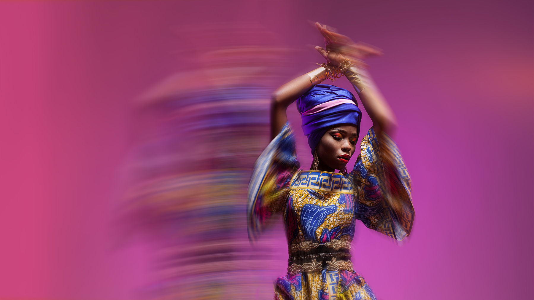 Dancer wearing colorful costume with a blur effect that conveys movement