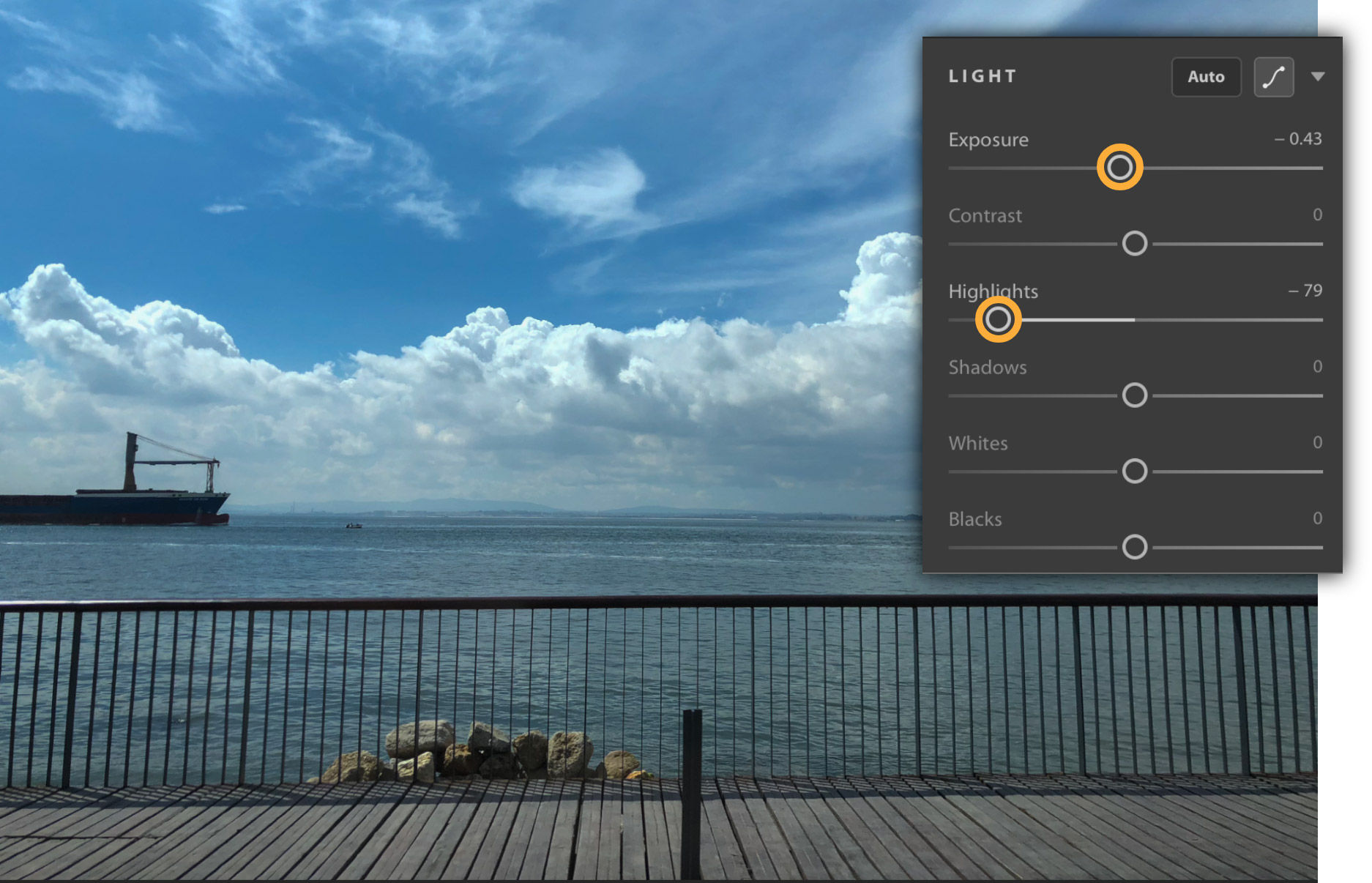 Exposure and Highlights are decreased, recovering details in the clouds.