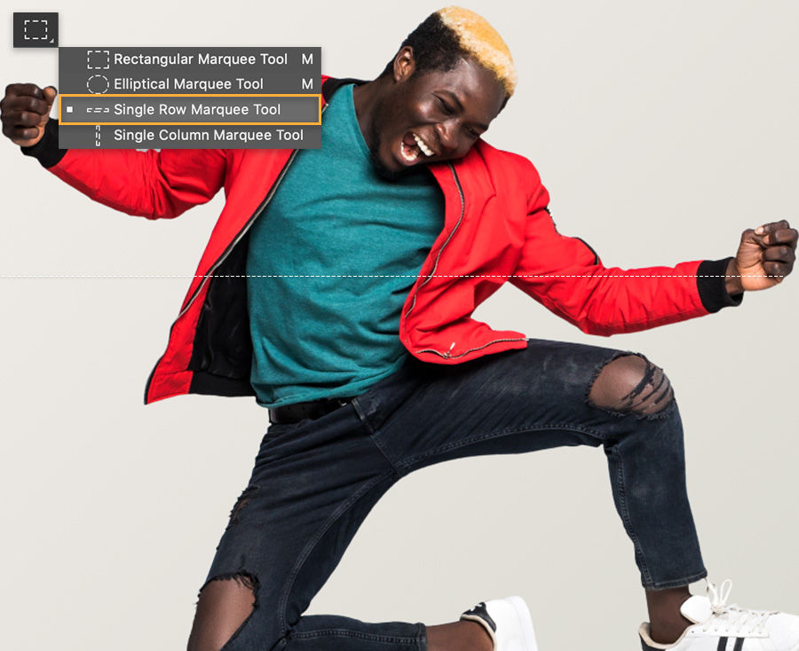 Adobe Photoshop toolbar with single row marquee tool selected, canvas shows man jumping in the air