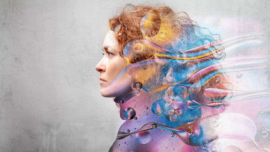 Profile of a woman's face with graphic designs layered over her hair