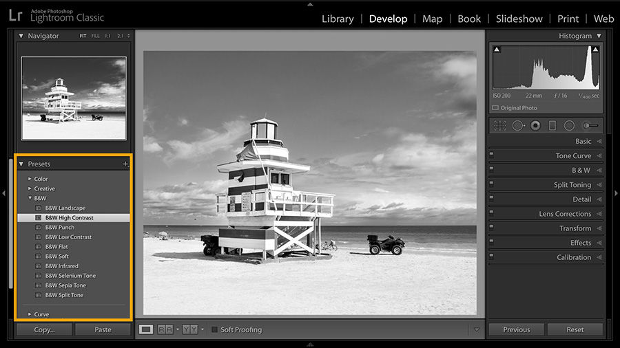A black and white preset is applied to the lifeguard tower photograph.