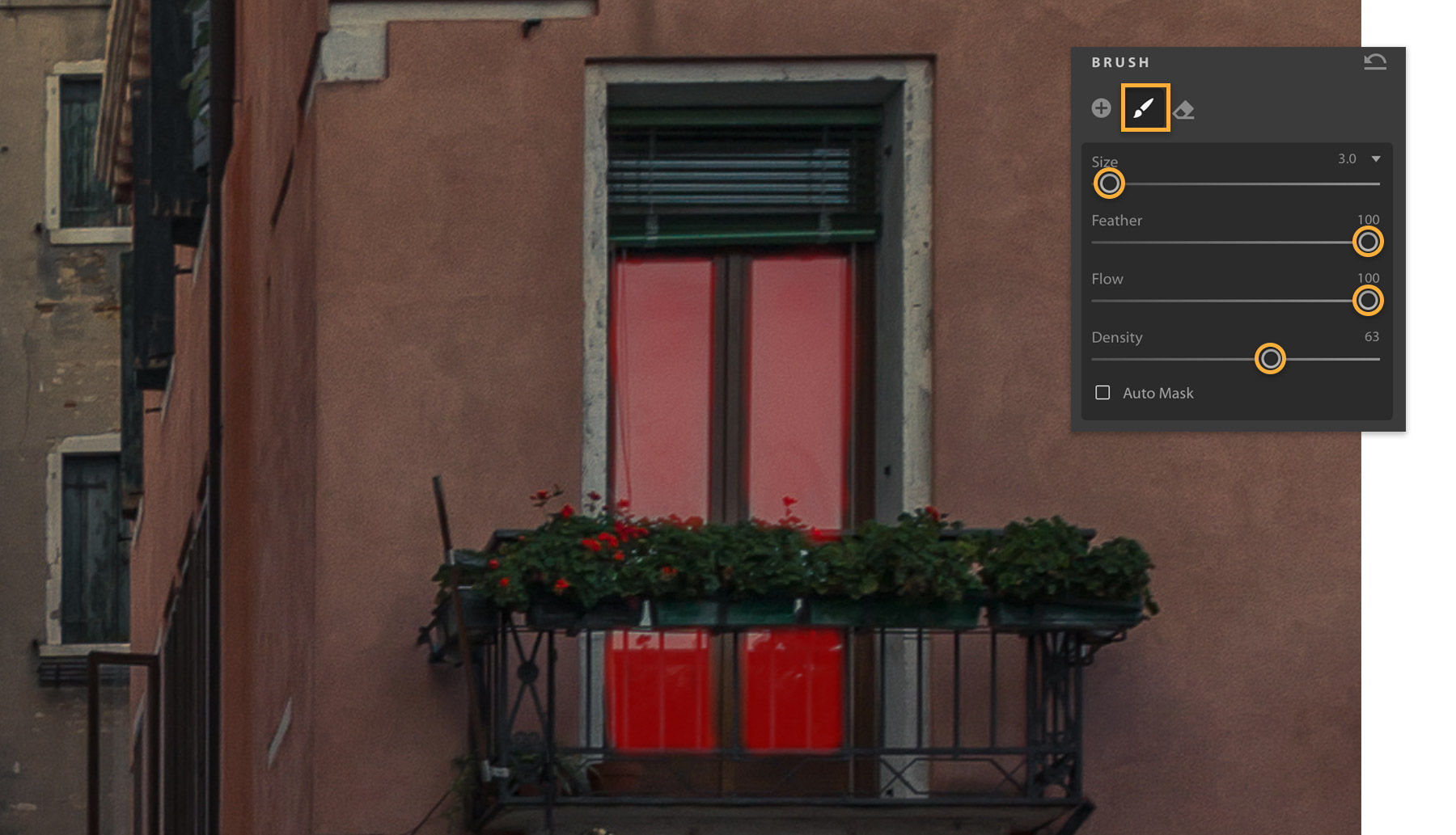 Brush tool is used to isolate a window to brighten. A red overlay shows the brushed-in areas.