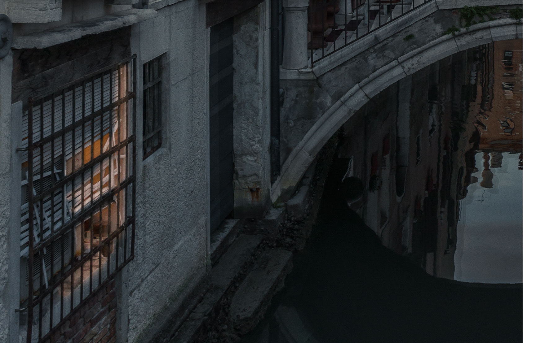 A second window is brushed over and the same effects are applied. It appears that a light is on in the window.