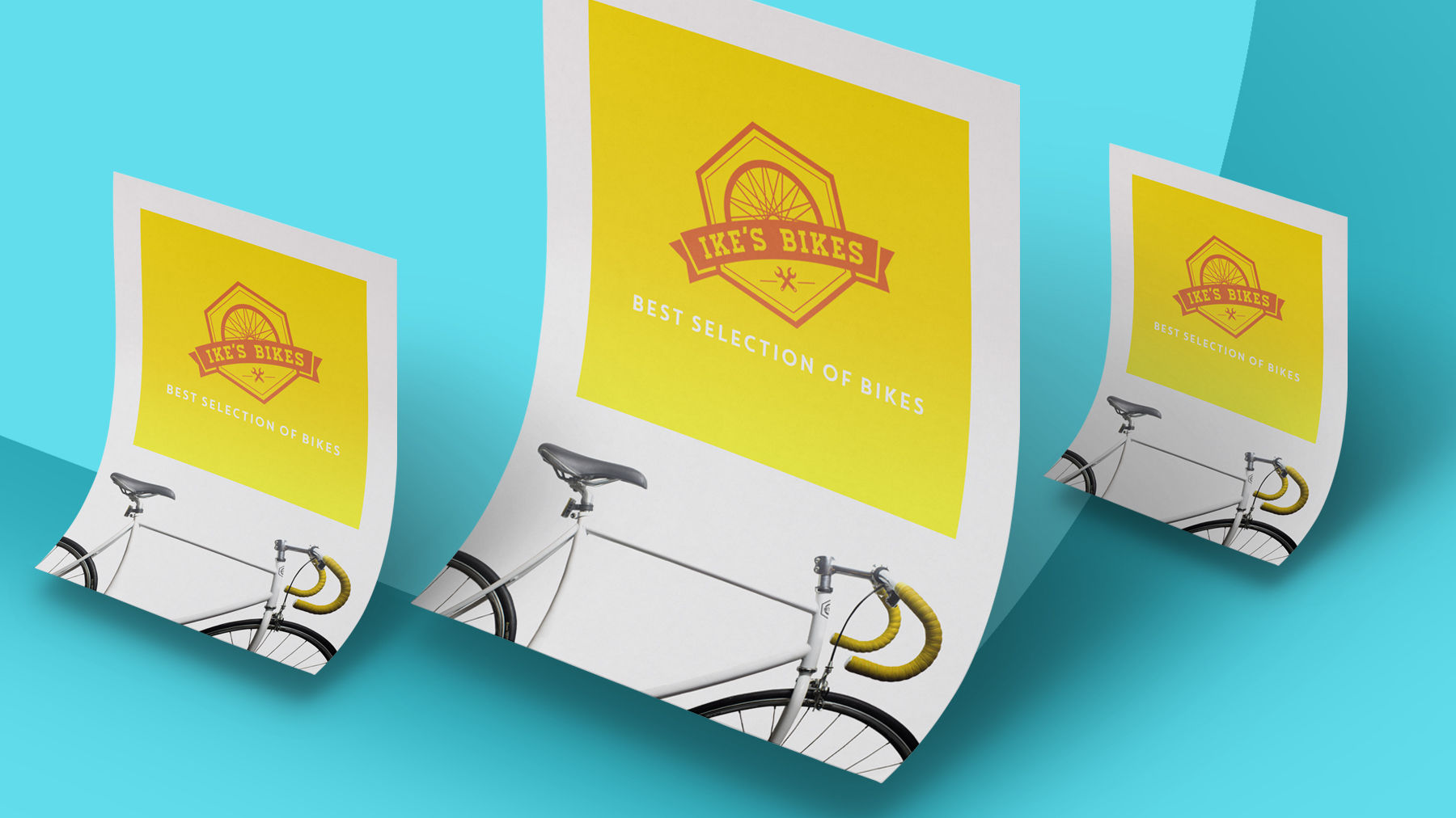 Three different sized business cards for Ike’s Bikes appear on a light blue backdrop