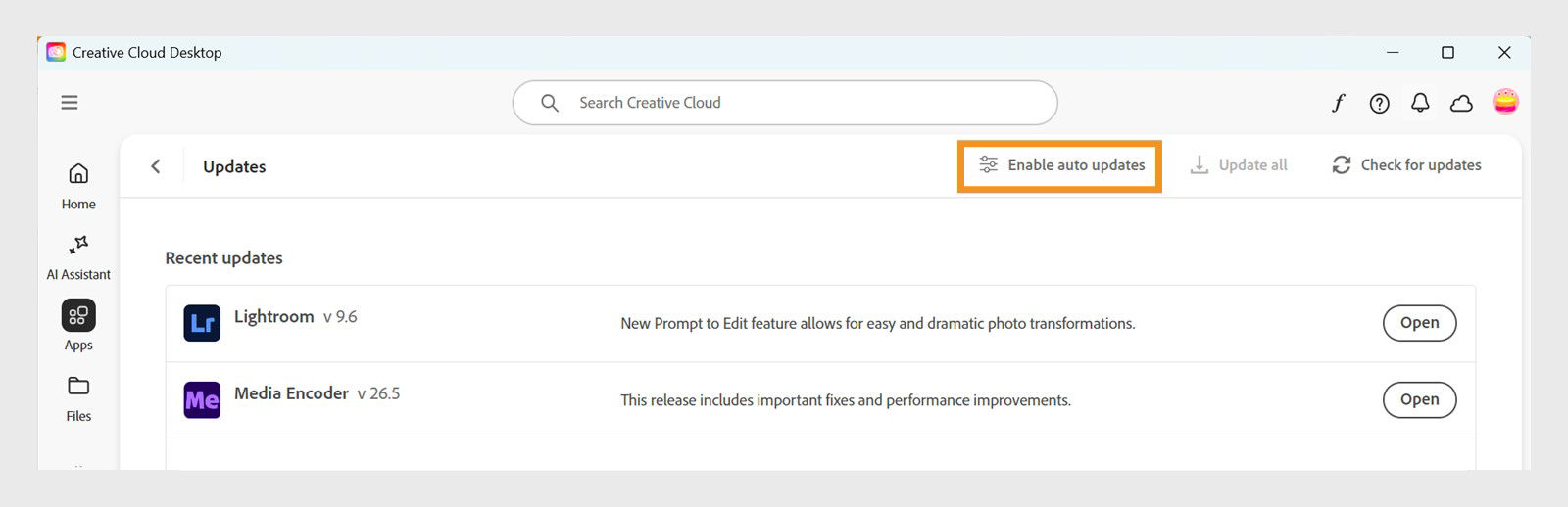 The Updates window provides an option to enable auto-updates, helping Creative Cloud apps stay up to date automatically.