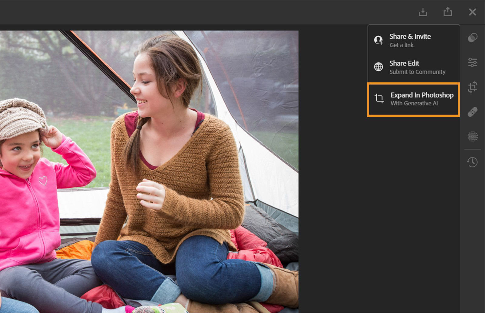 A boy and girl image is opened in Lightroom on the web where Expand in Photoshop menu is selected.