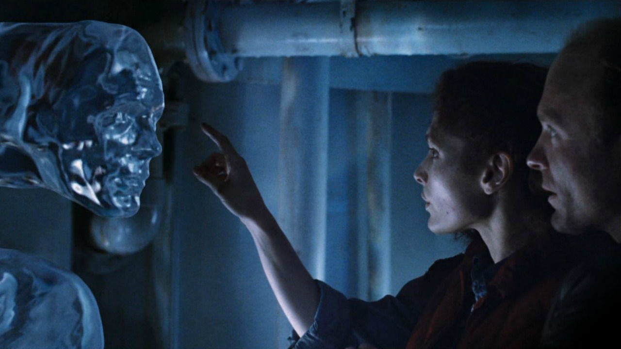 A scene from James Cameron's The Abyss in which Mary Mastrantonio reaches out to touch the CGI water tentacle.