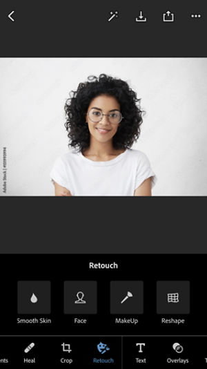 The Retouch tools for Smooth Skin, Face, MakeUp, and Reshape are displayed under a woman with dark hair and glasses. 