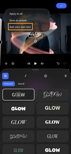 The Premiere mobile editor displays the More options menu with Add your own font highlighted in orange, below Apply to all and Save as preset.