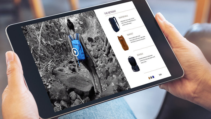 Commerce site features black and white video of hiker wearing blue backpack.