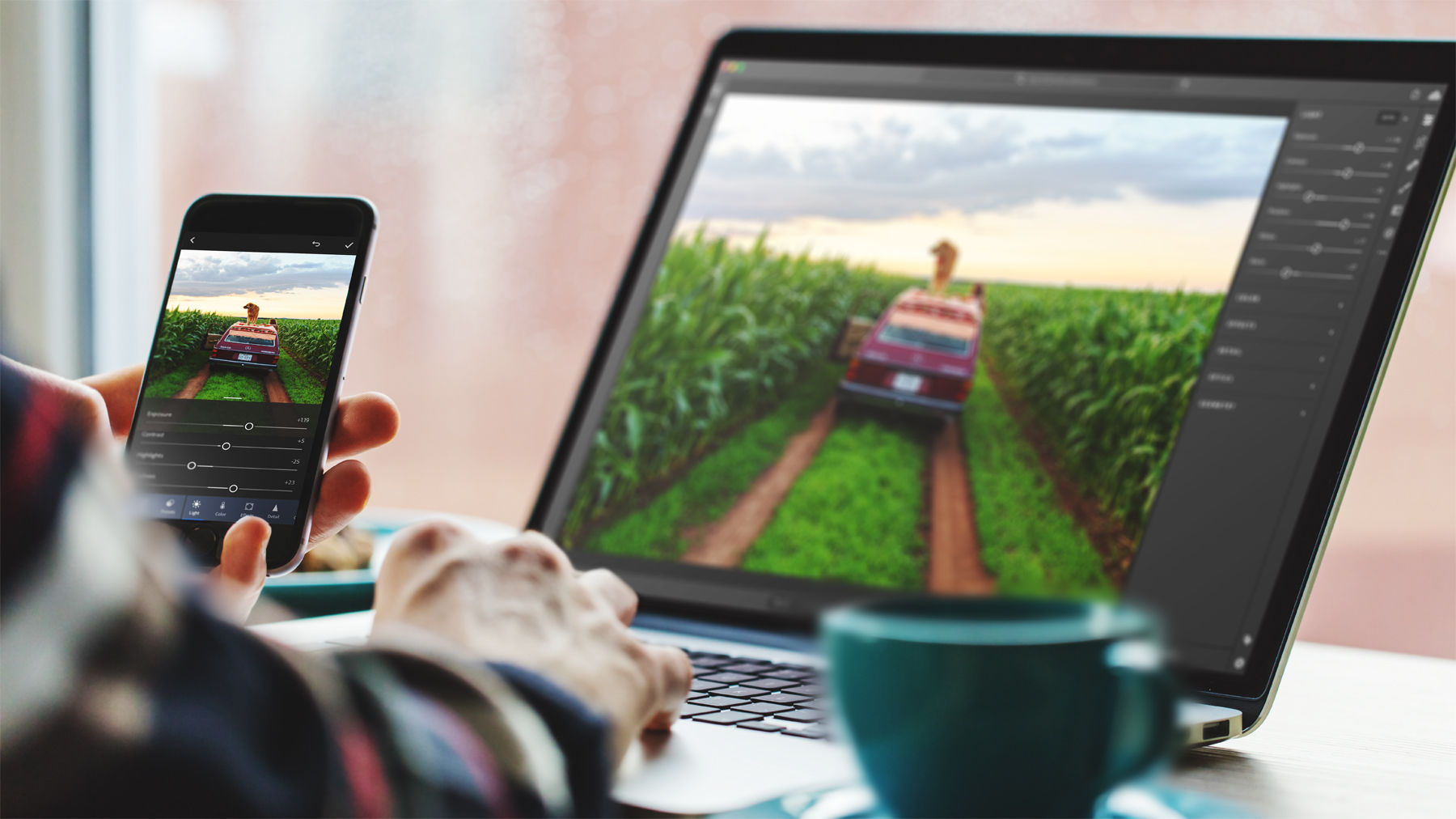 Lightroom on mobile device and laptop feature the same image of a car driving through rows of a cornfield.