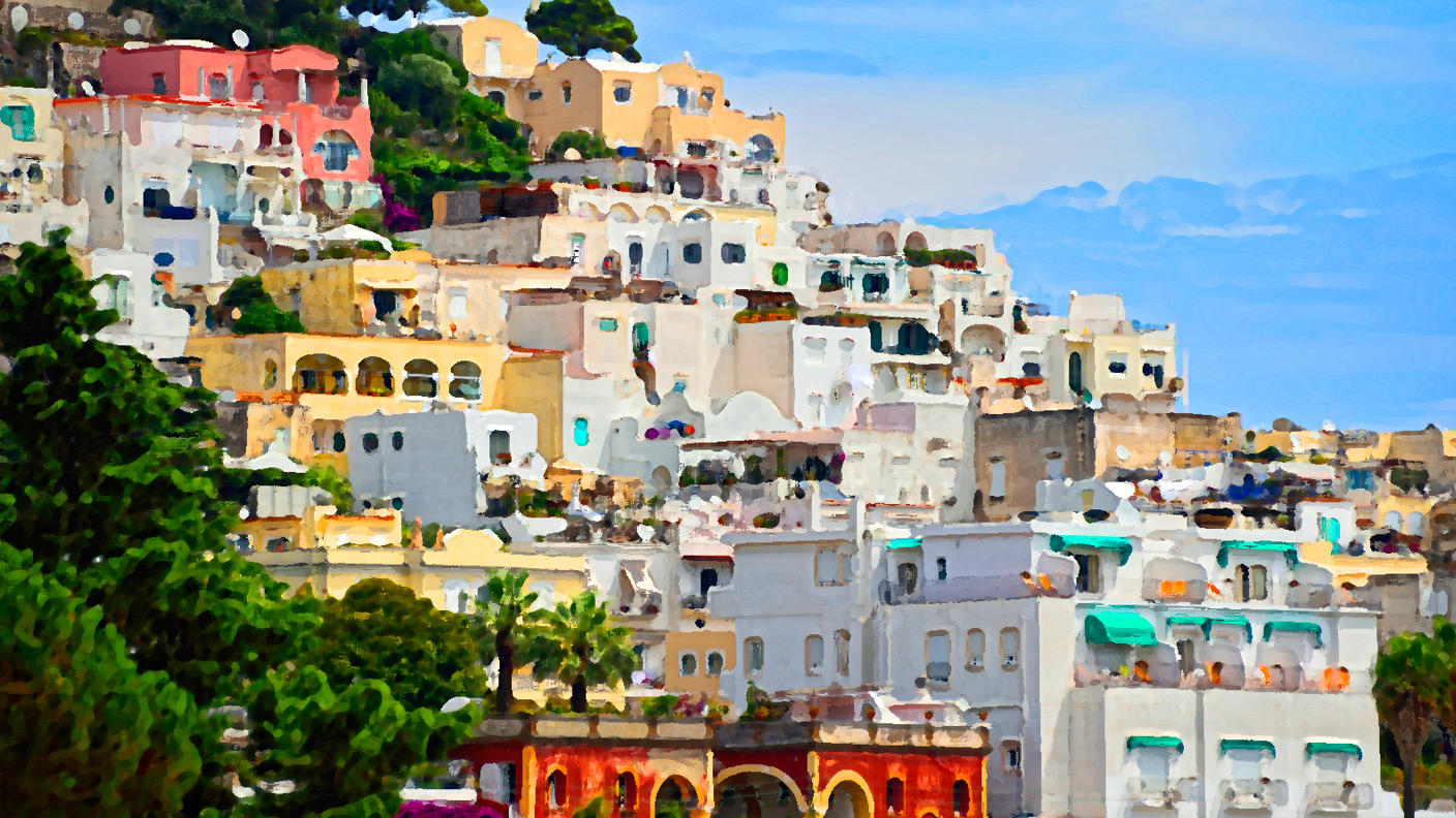 Seaside town on a hillside photo appears hand-painted after applying artistic filters in Photoshop