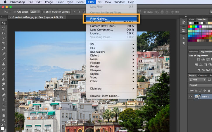 Coastal town on hillside appears in the Photoshop window. Filter Gallery is selected