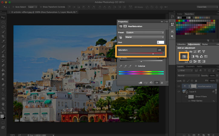 A Hue/Saturation adjustment layer is added to intensify the colors of the coastal town.