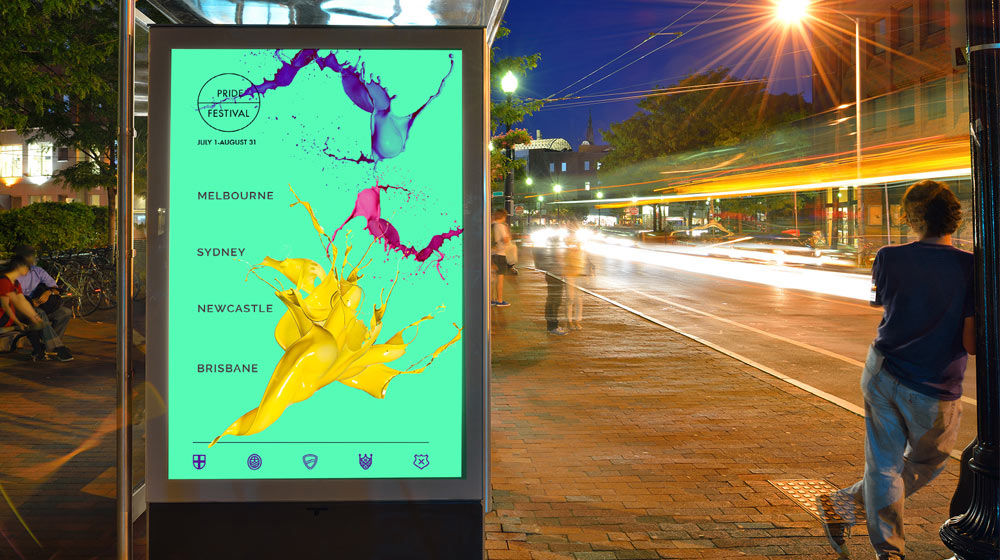Sea green Australia Pride Festival poster with purple, pink, and yellow paint splashes hangs on bus stop wall
