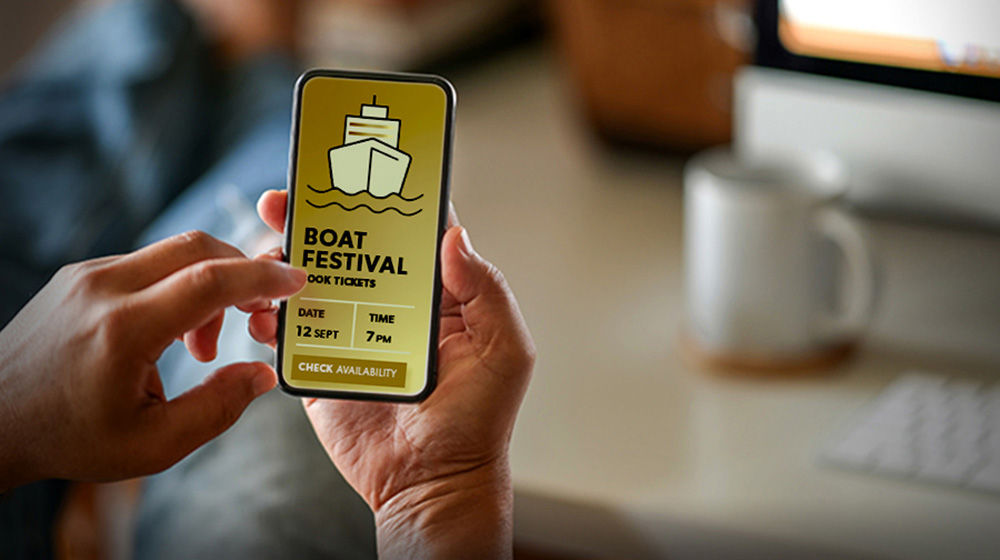 Cell phone displays boat festival ticket ordering site 