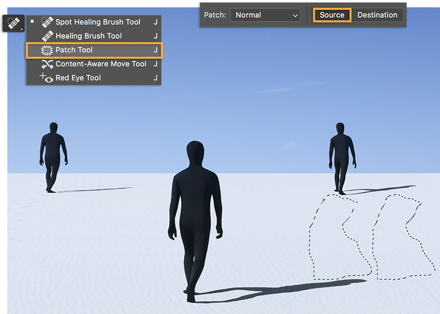 Three men in sand with footprints. Patch tool set to Source selects prints to remove. Selection moved to sand with no prints.