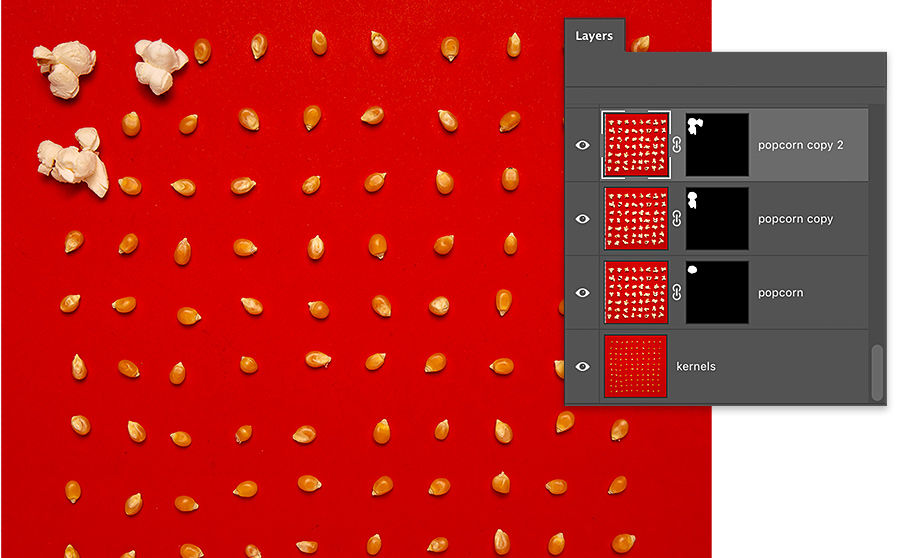 3 kernels of popcorn on red background are popped, remaining kernels are un popped, photoshop layers panel has 4 layers, 3 with layer mask