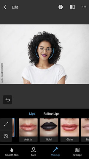 Pink lipstick has been added to a photo of a woman with dark hair and glasses. MakeUp Retouch options are shown under the photo.