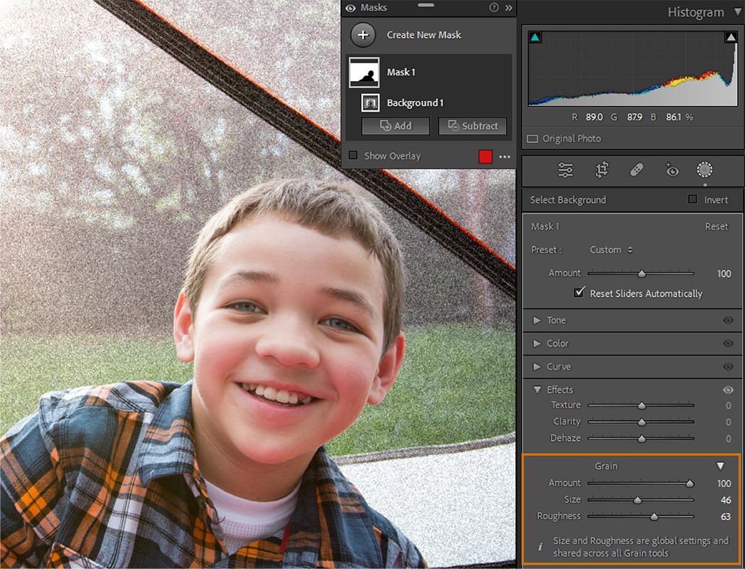 Image of a boy with grained background and Lightoom Classic UI highlighting Grain sliders