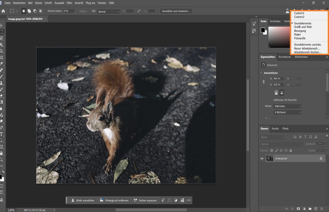 Photoshop-Benutzeroberfläche mit dem Dropdown-Menü „Arbeitsbereich wählen“ mit Optionen wie Grundlagen, Fotografie und benutzerdefinierten Arbeitsbereichen.