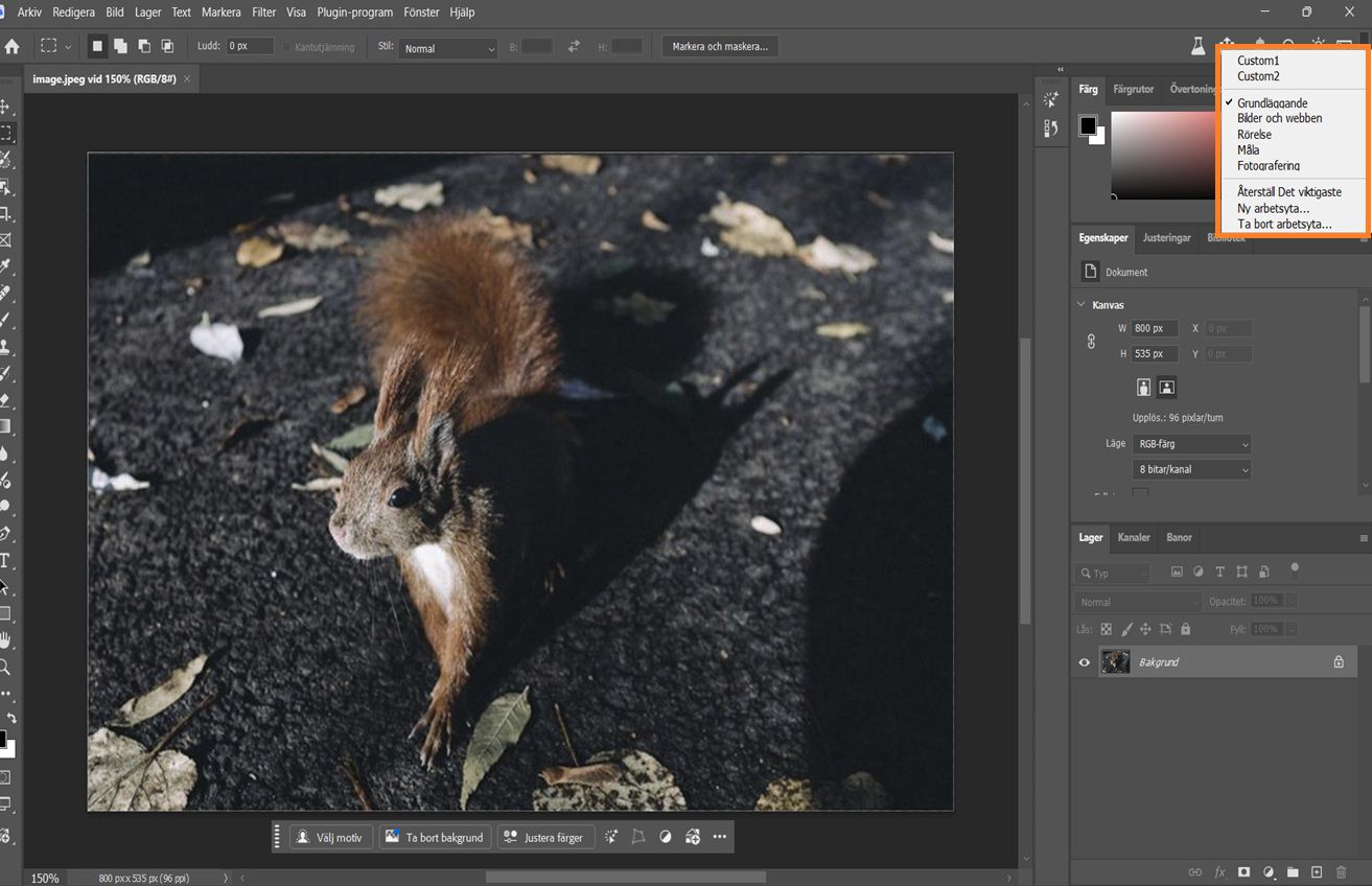 Photoshop-gränssnittet visar rullgardinsmenyn Välj en arbetsyta med alternativ som Grundläggande, Fotografi och anpassade arbetsytor.