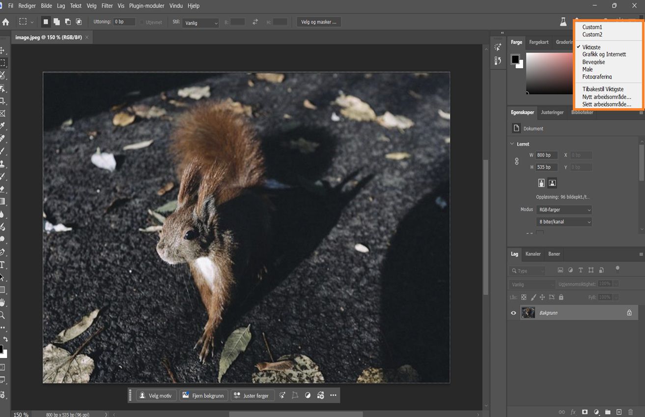 Photoshop-grensesnitt som viser rullegardinmenyen Velg et arbeidsområde med options som Grunnleggende, Foto og tilpassede arbeidsområder.