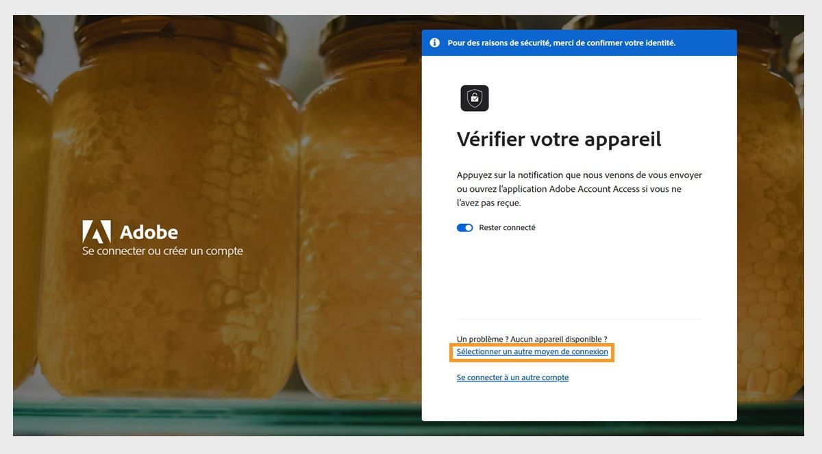 La page de connexion Adobe, avec la fenêtre Vérifiez votre appareil, où Sélectionner un autre moyen de connexion est mis en surbrillance.
