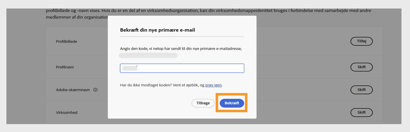 Dialogboksen Bekræft din mail med et felt til at indtaste verifikationskoden og den fremhævede knap Verificér.