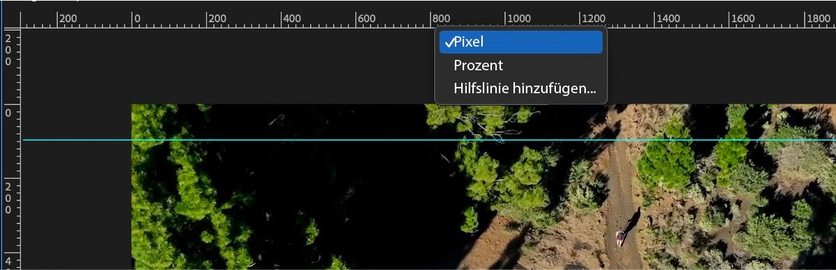 Der Programmmonitor zeigt Messoptionen an, einschließlich Pixel, Prozent und dem Hinzufügen von Hilfslinien.
