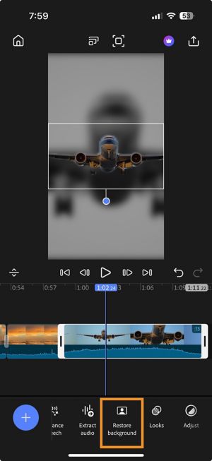 Timeline with a selected clip and the Restore background option highlighted in the bottom toolbar.