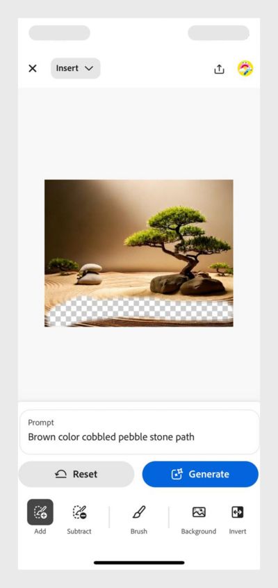 The image shows a Zen garden with sand, a tree and a shrub and a pile of brown smooth stones. Using the brush tool an empty space is created to add new elements.