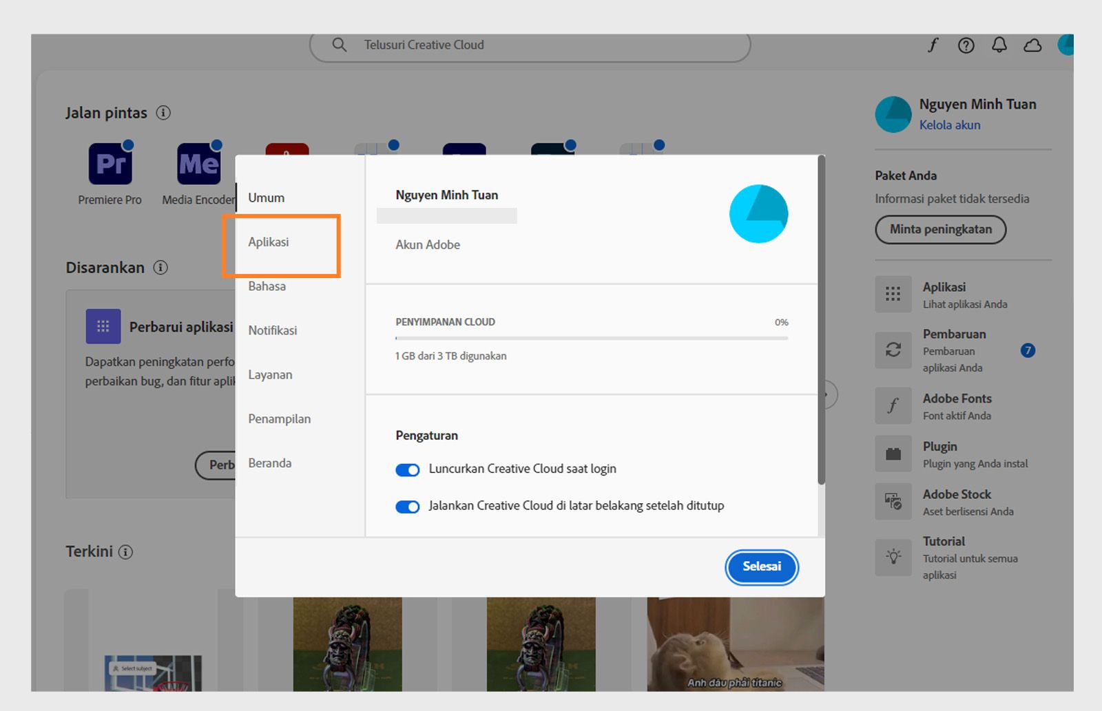 Panel preferensi Adobe Creative Cloud terbuka pada tab "Aplikasi", menampilkan opsi untuk pembaruan otomatis, lokasi instalasi, dan penggunaan bandwidth.