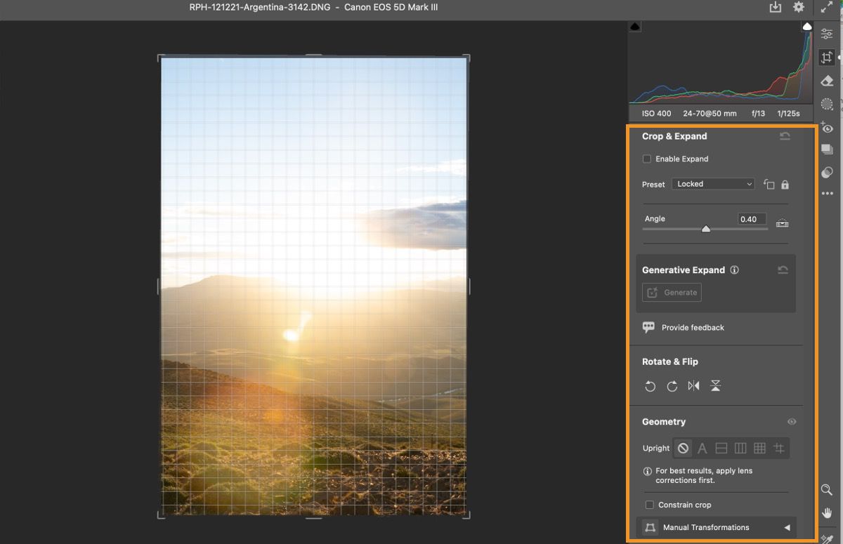 Photo of a sunset is open in Adobe Camera Raw. Adjust the size and perspective with Crop tools. 