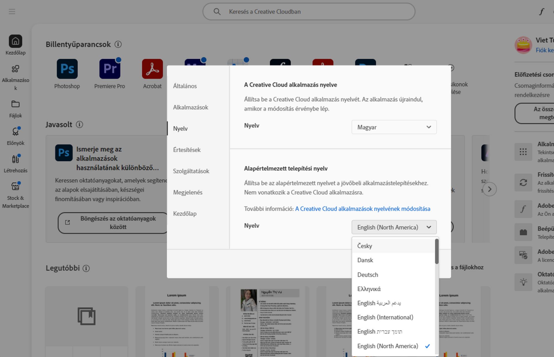A Beállítások ablak Nyelv füle megjeleníti a Creative Cloud asztali alkalmazás nyelvének és az alapértelmezett telepítési nyelvnek a kiválasztására szolgáló lehetőségeket.