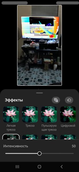 Панель «Эффекты» с примененным к клипу эффектом сбоя и ползунком «Интенсивность», установленным на 61.