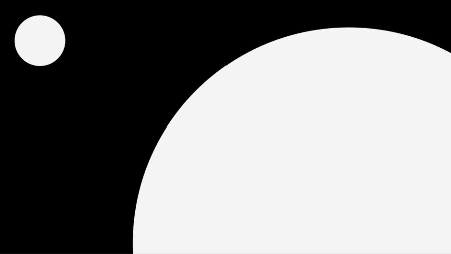 Two white circles on a black background. One large, one small showing balance and alignment in graphic design