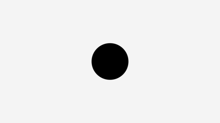 A black circle on a white backgroundshowing use of white space in graphic design