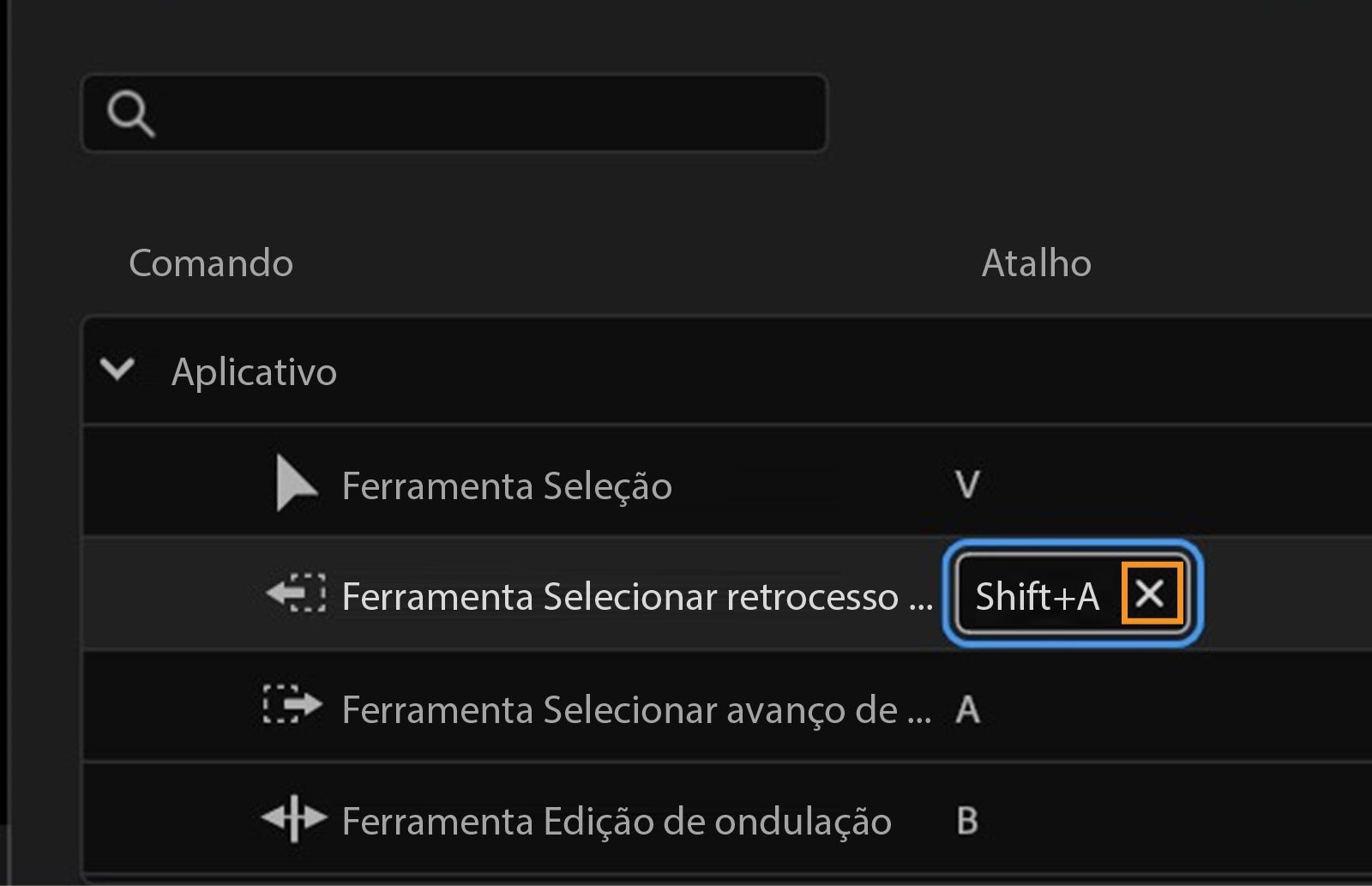 O painel mostra que Shift+A está atualmente atribuído à ferramenta Seleção de faixa anterior, e você pode clicar em X para remover o atalho.