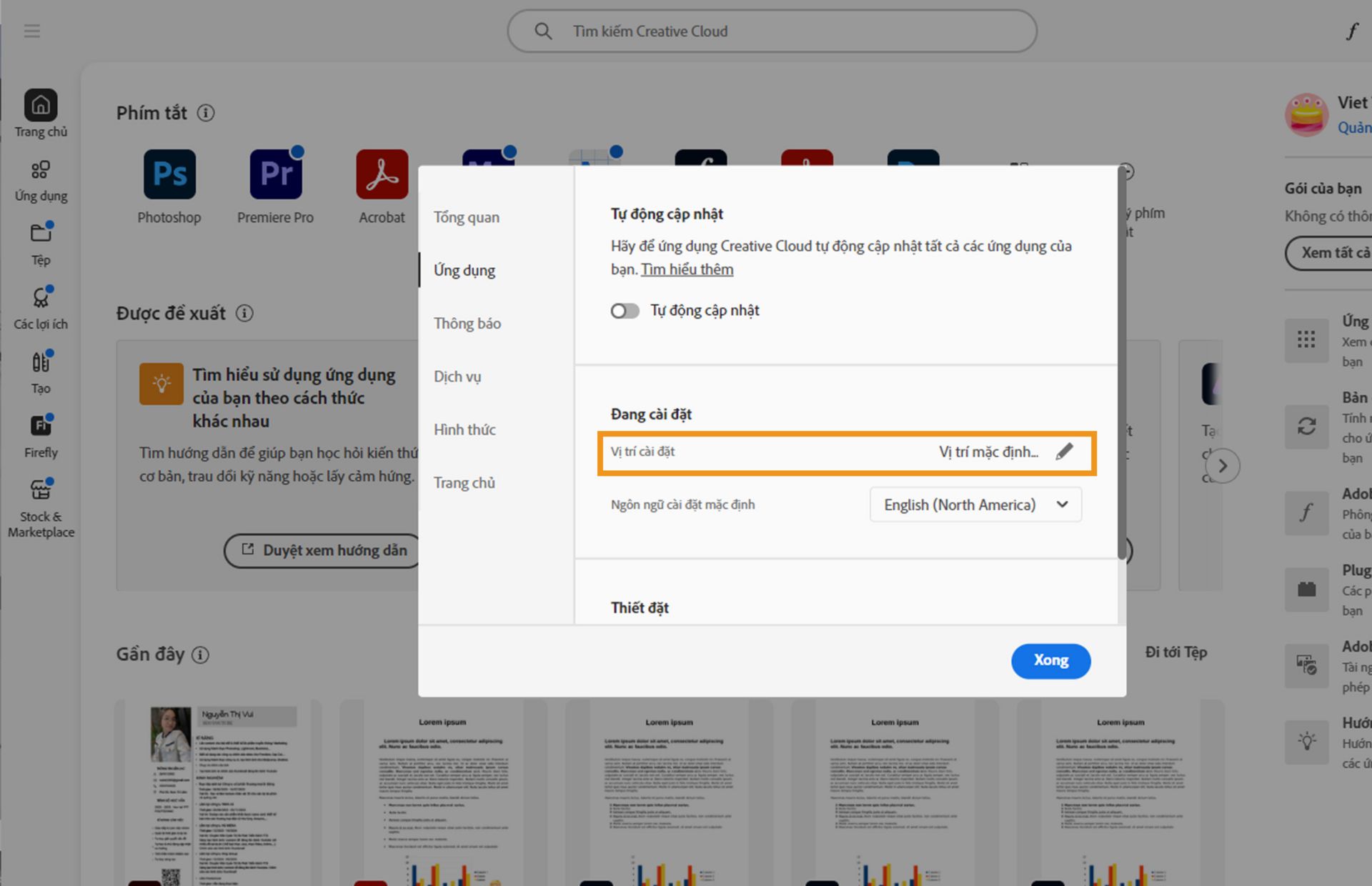 Bảng lựa chọn ưu tiên của Adobe Creative Cloud đang mở trên tab Ứng dụng, làm nổi bật mục &quot;Cài đặt&quot;, nơi người dùng có thể đặt vị trí cài đặt mặc định.