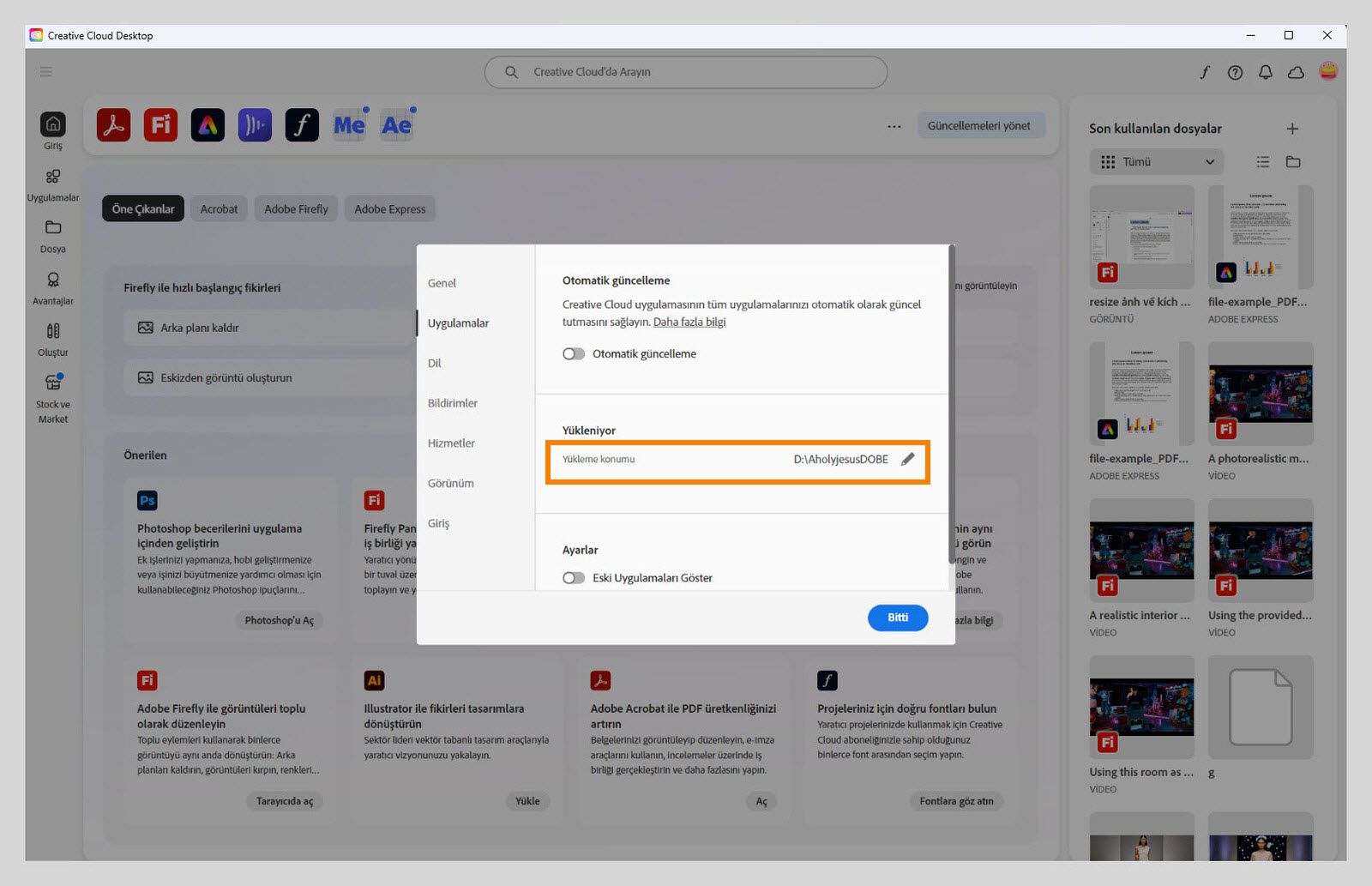 "Uygulamalar" sekmesinde açık olan Adobe Creative Cloud tercihleri paneli, kullanıcıların varsayılan yükleme konumunu ayarlayabilecekleri "Yükleniyor" bölümünü vurguluyor.