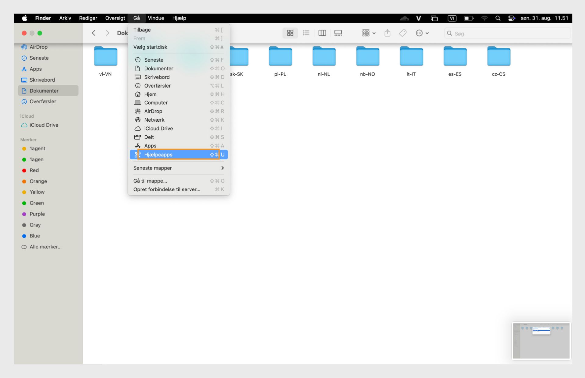 Vinduet Finder i macOS, der fremhæver mappen Hjælpeprogrammer i venstre sidepanel.