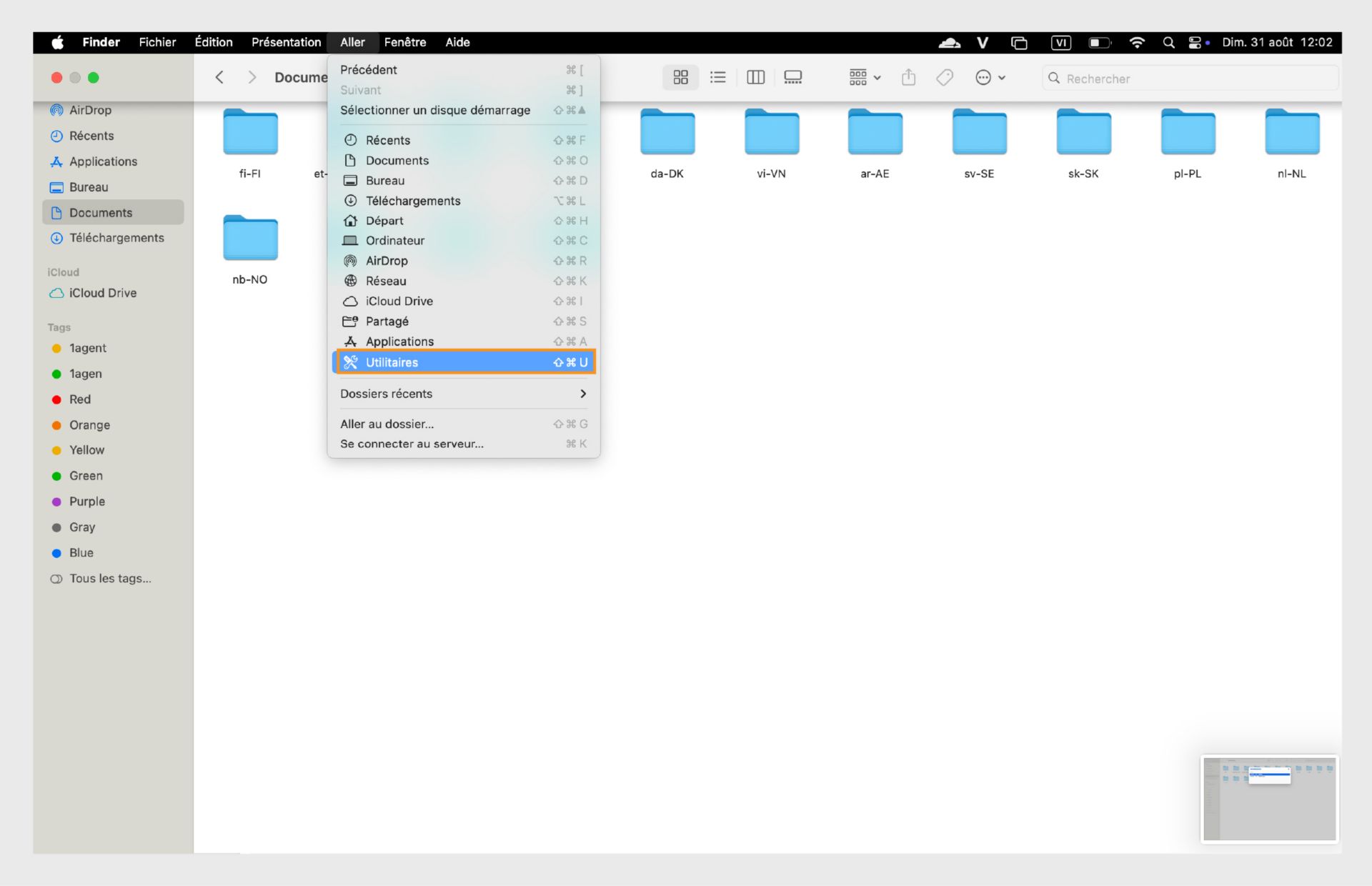 Fenêtre du Finder de macOS mettant en évidence le dossier Utilitaires dans la barre latérale gauche.